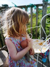 Close-up of girl holding doll