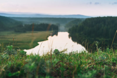 Beautiful view on morning calm river, forest and hills. local tourism