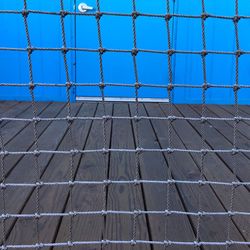 Close-up of soccer field against blue sky