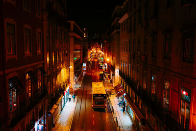 High angle view of road along buildings at night