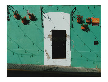 Close-up of damaged wall against building