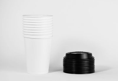 Close-up of beer glass on table against white background