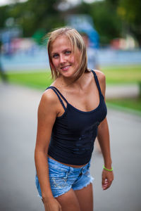 Portrait of teenage girl standing outdoors