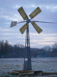 Traditional windmill against sky