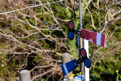 Close-up of arrow sign on field