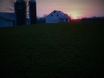 Buildings against sky at sunset