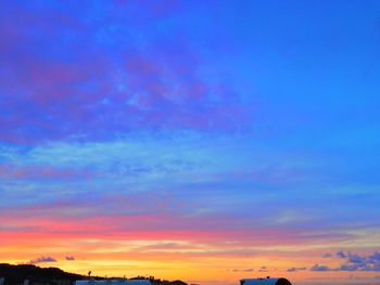 Low angle view of dramatic sky during sunset