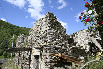 Low angle view of old building against sky