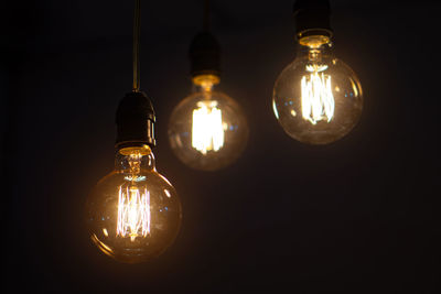 Low angle view of illuminated light bulb