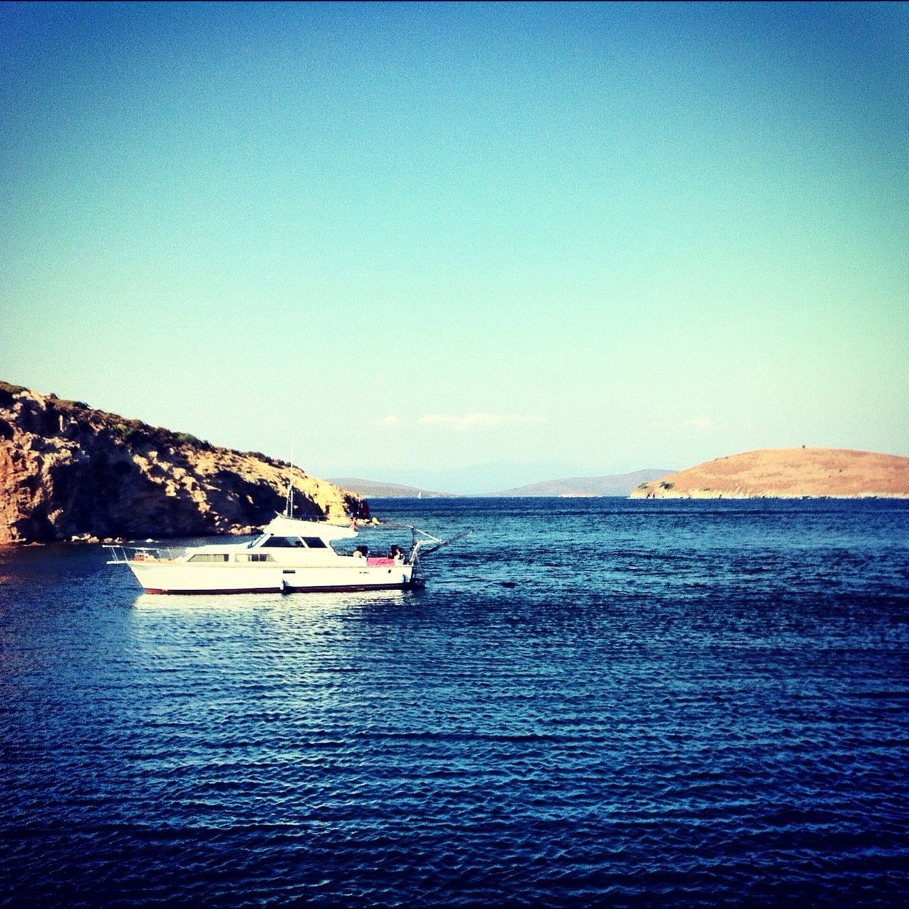 sea, water, copy space, clear sky, tranquil scene, blue, tranquility, waterfront, scenics, horizon over water, beauty in nature, nature, rippled, idyllic, seascape, nautical vessel, calm, remote, ocean, outdoors