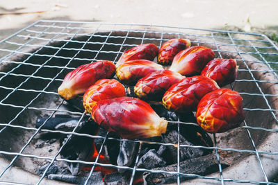 High angle view of meat on barbecue grill