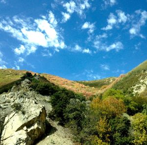 Scenic view of mountains against blue sky