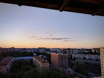 High angle view of buildings against sky during sunset