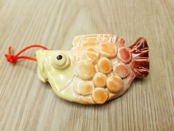 High angle view of fish figurine on table