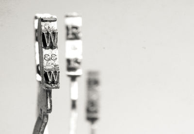 Close-up of telephone booth against white background