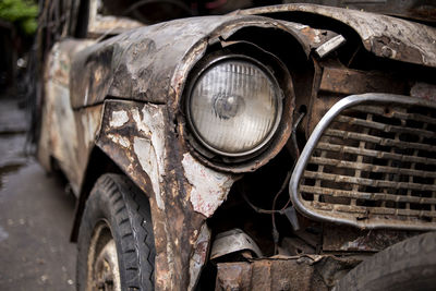 Close-up of abandoned car