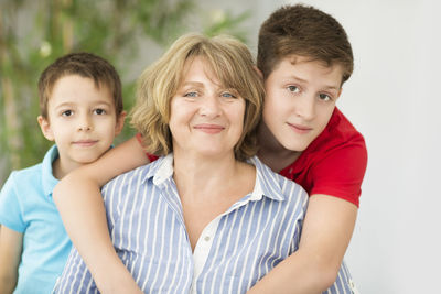 Portrait of happy mother and sons