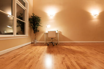 Illuminated lights on hardwood floor at home