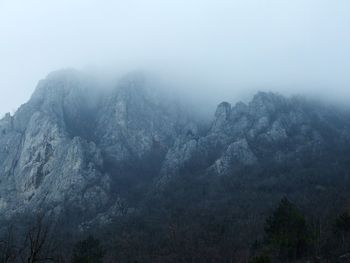 Scenic view of mountains against sky during winter