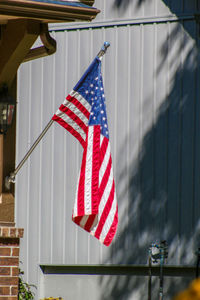 Close-up of flags hanging against the wall