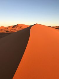 Scenic view of desert against clear sky