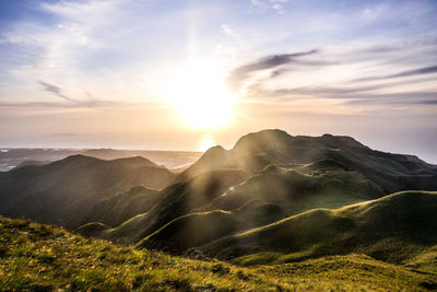 Scenic view of mountains against sky during sunset