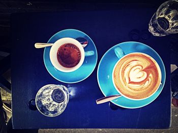 Close-up of cappuccino served on table