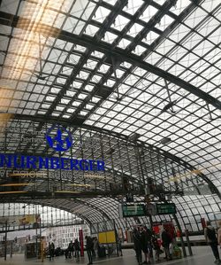 Low angle view of people at railroad station