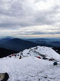 Scenic view of snowcapped mountains against sky
