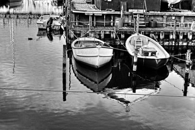 Boats moored at harbor