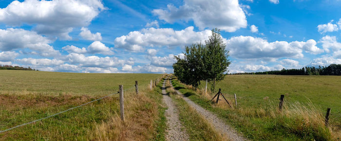 Panoramic shot of field against sky