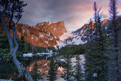 A coloful and moody sunrise at dream lake in rocky mountain national park, colorado.
