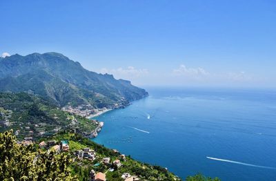 High angle view of sea against blue sky