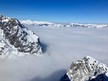 Scenic view of snowcapped mountains against sky