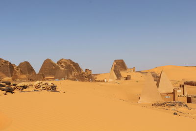 Scenic view of desert against clear sky