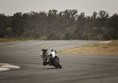 Man riding motorcycle on road