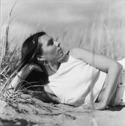 Young woman sitting on field