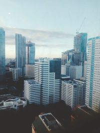 Modern buildings in city against sky