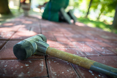 Cropped hand of man working on wood