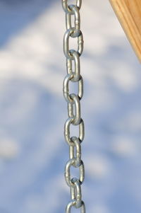 Close-up of chain against blurred background