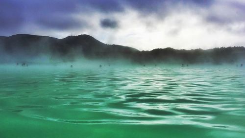 Scenic view of sea against cloudy sky