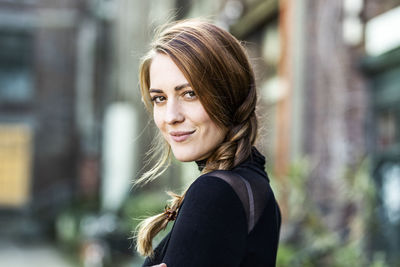 Portrait of smiling woman with braid