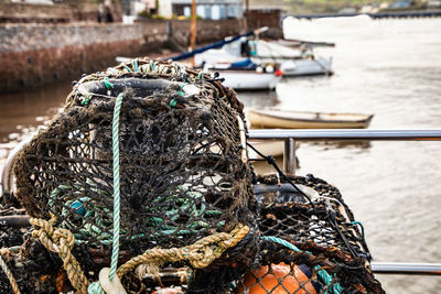 Close-up of fishing net by sea