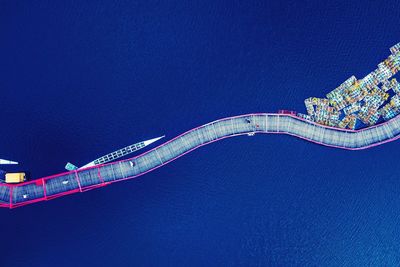 Low angle view of illuminated building against blue sky