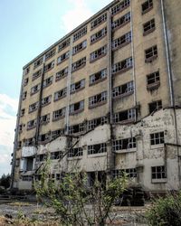 Low angle view of old building against sky