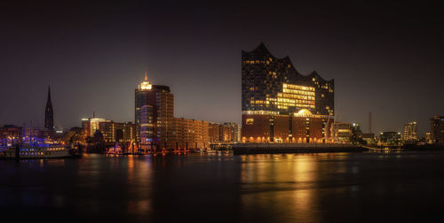 Illuminated buildings at waterfront