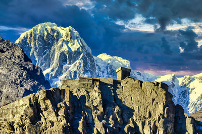 Panoramic view of snowcapped mountains against sky