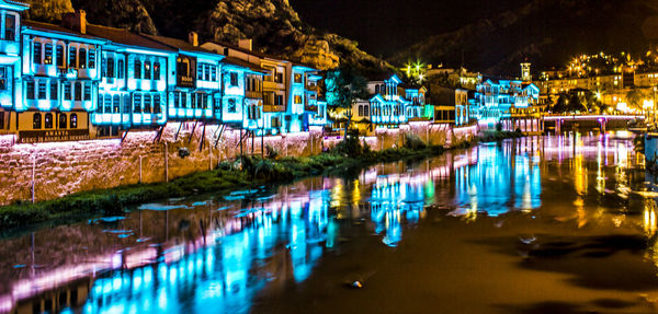 Reflection of illuminated buildings in water