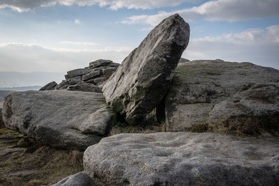 Rock formation on land against sky