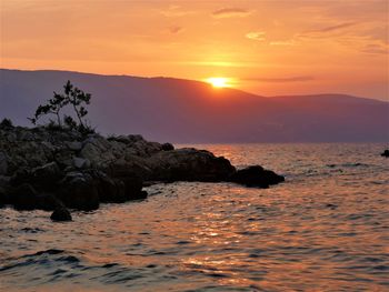 Scenic view of sea against sky during sunset